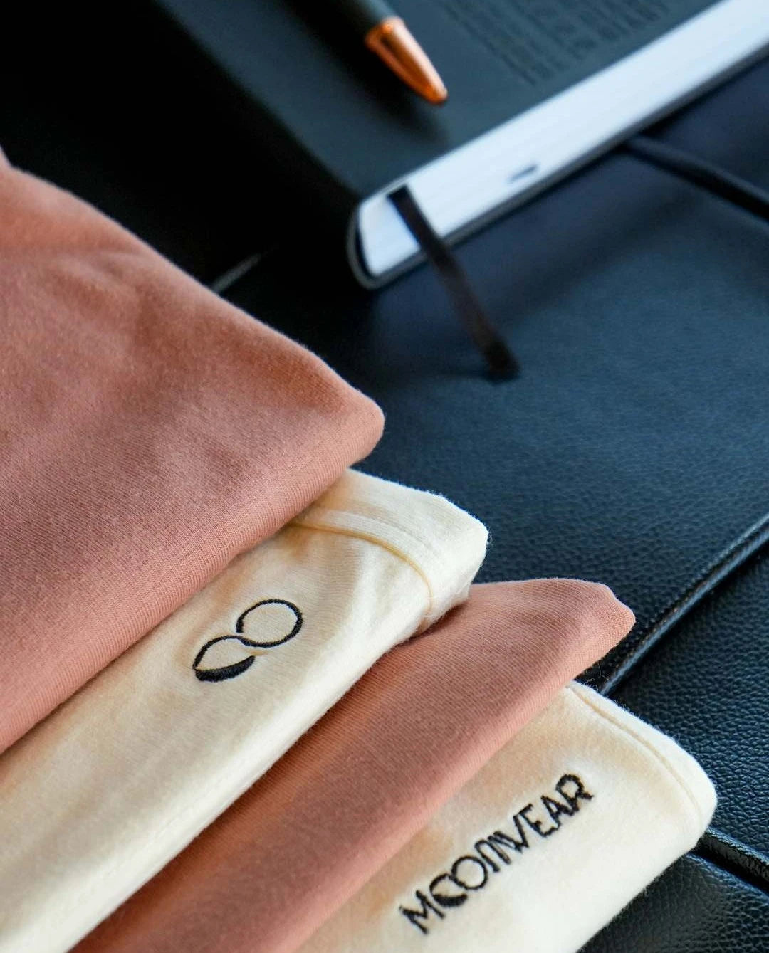 Neatly folded stack of Premium loungewear pieces for men